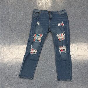 Trendy Blue Distressed Jeans with Red Accents